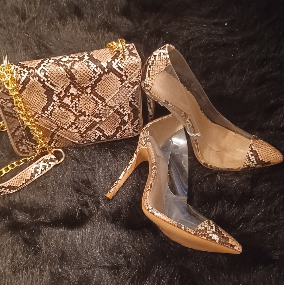 Ladies snake clear heels with matching hand bag